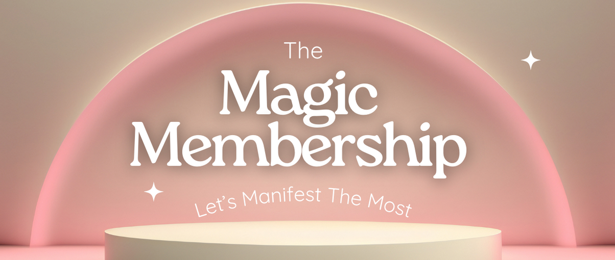 Promotional banner for "The Magic Membership" by Hannah Summerhill. The text "The Magic Membership" is written in a bold, white serif font against a soft pink arched background, with the tagline "Let’s Manifest The Most" below it. The design features a minimalist, dreamy aesthetic with a beige pedestal in the foreground and small white sparkles.